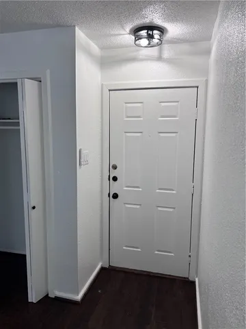 a living room with couch and a flat screen tv