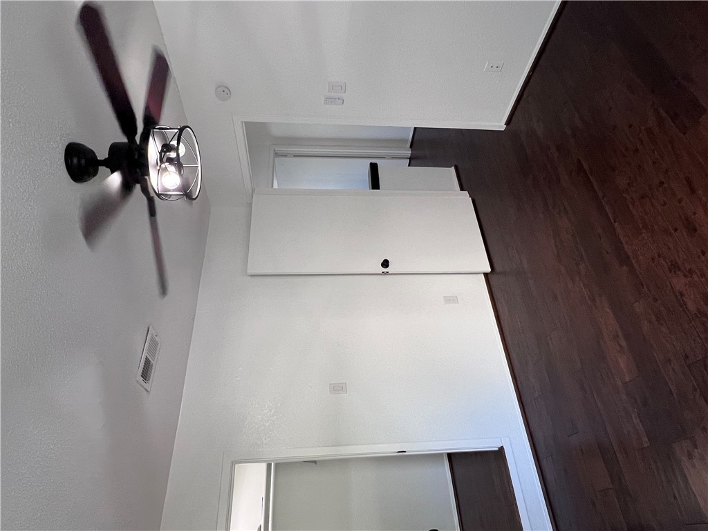 4507 Carter Creek Parkway, Unit 2 Bryan, TX 77802 - Photo 22 of 26 a view of an empty room with wooden floor