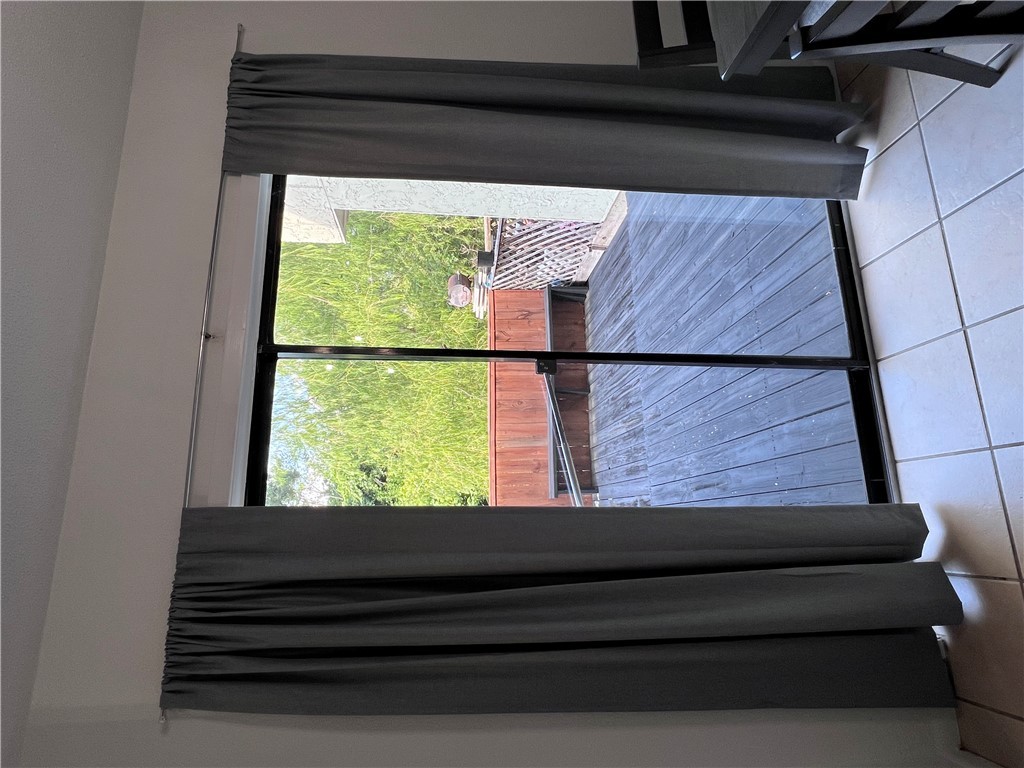 4507 Carter Creek Parkway, Unit 2 Bryan, TX 77802 - Photo 24 of 26 a view of a room with wooden floor and furniture