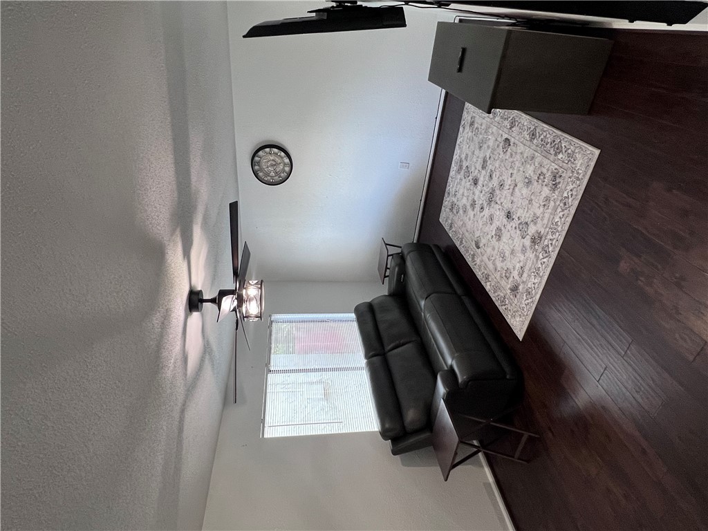 4507 Carter Creek Parkway, Unit 2 Bryan, TX 77802 - Photo 3 of 26 a living room with couch and a flat screen tv