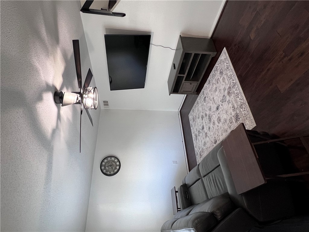 4507 Carter Creek Parkway, Unit 2 Bryan, TX 77802 - Photo 4 of 26 a living room with furniture and a flat screen tv