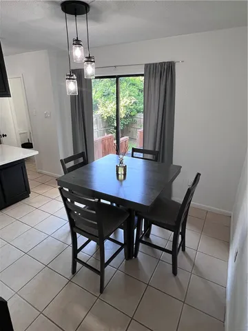 a kitchen with stainless steel appliances a sink and a refrigerator