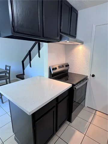 a shelf with books and knick knacks on it
