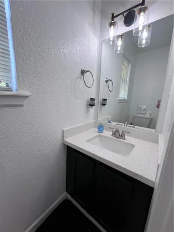 a bathroom with a toilet and a sink