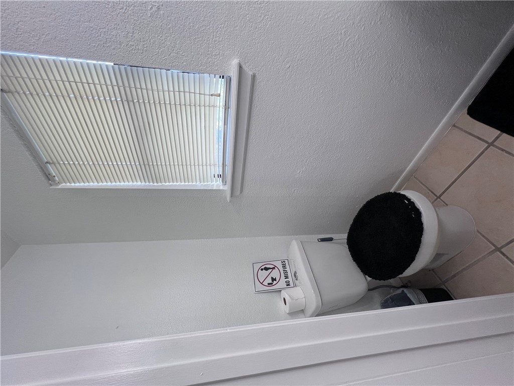 4507 Carter Creek Parkway, Unit 2 Bryan, TX 77802 - Photo 10 of 26 a bathroom with a toilet and a sink