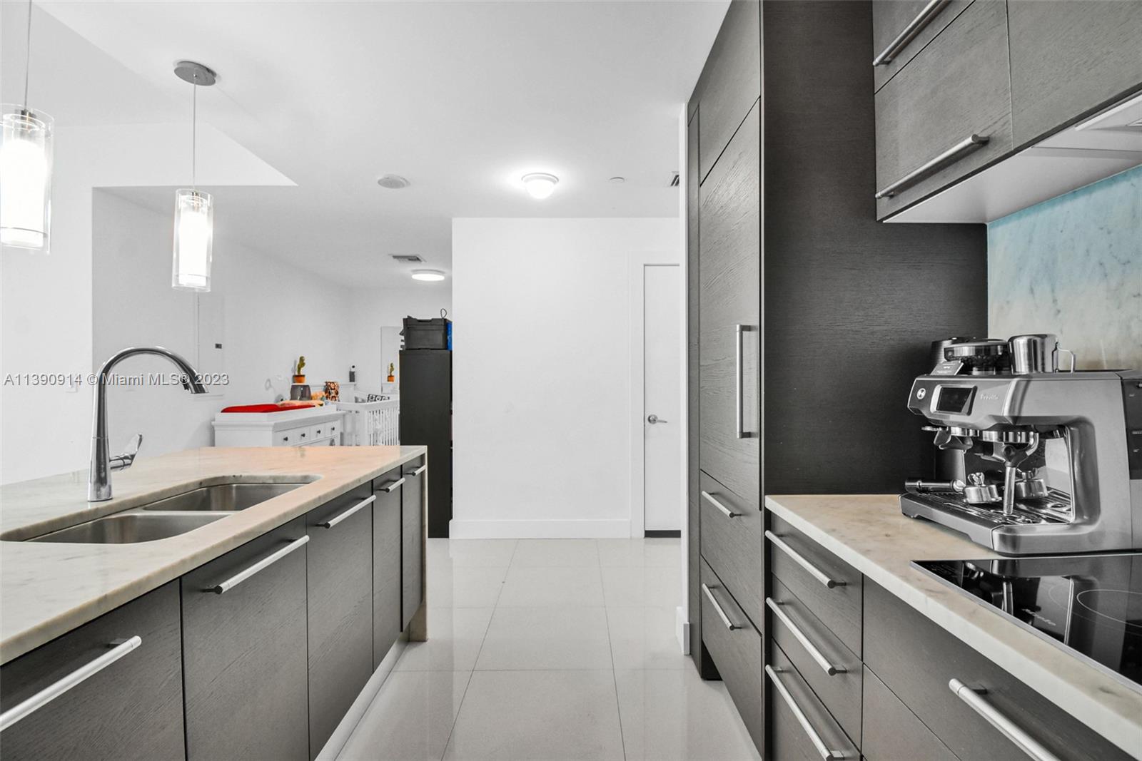 900 Biscayne Boulevard, Unit 4510 Miami, FL 33132 - Photo 15 of 48 a kitchen with stainless steel appliances granite countertop a sink and a refrigerator