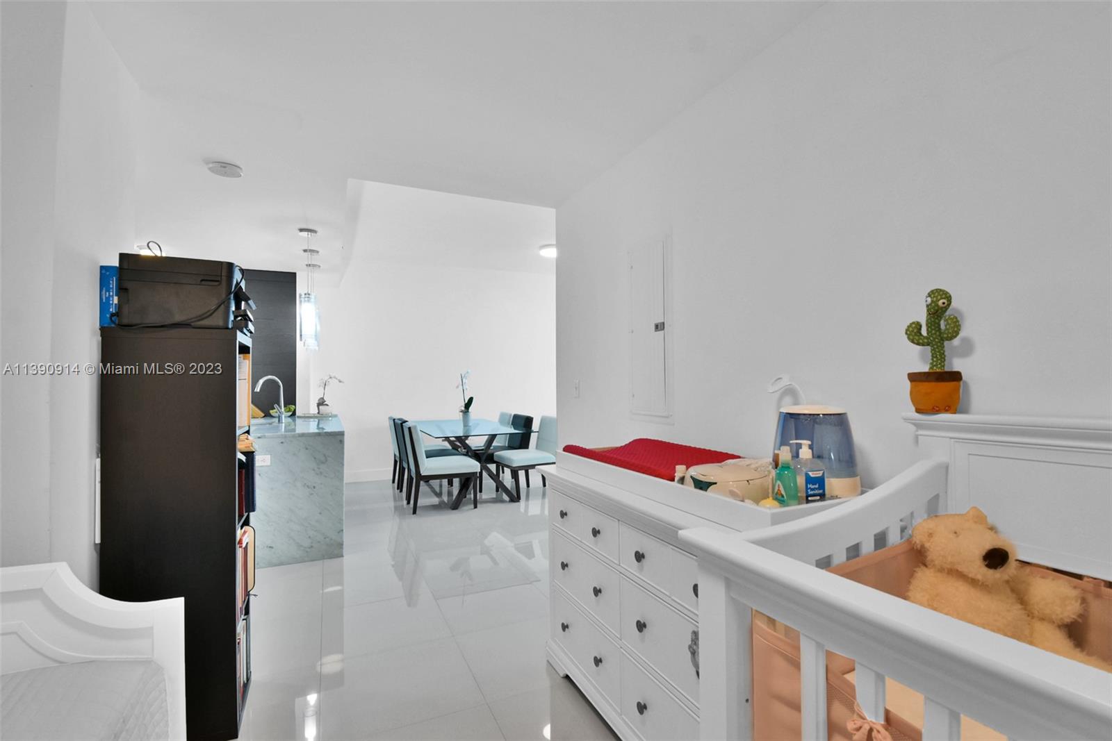 900 Biscayne Boulevard, Unit 4510 Miami, FL 33132 - Photo 16 of 48 a bedroom with furniture and a book shelf