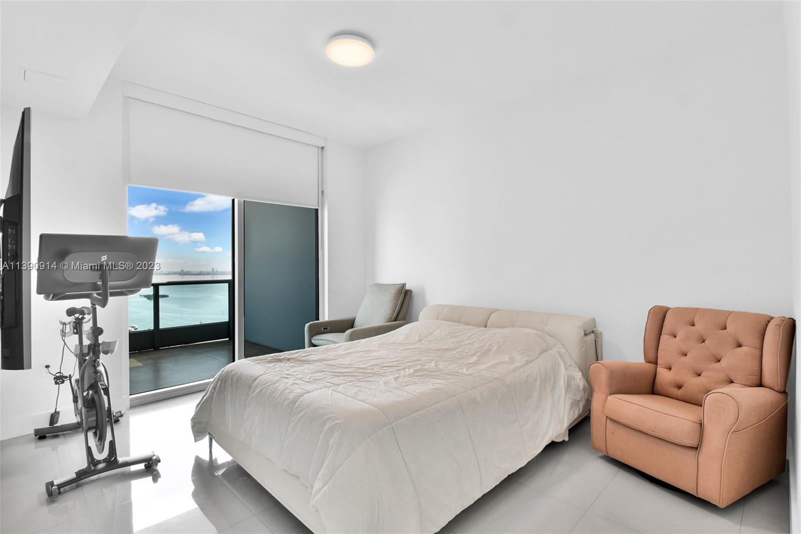 900 Biscayne Boulevard, Unit 4510 Miami, FL 33132 - Photo 18 of 48 a bedroom with a bed and a couch