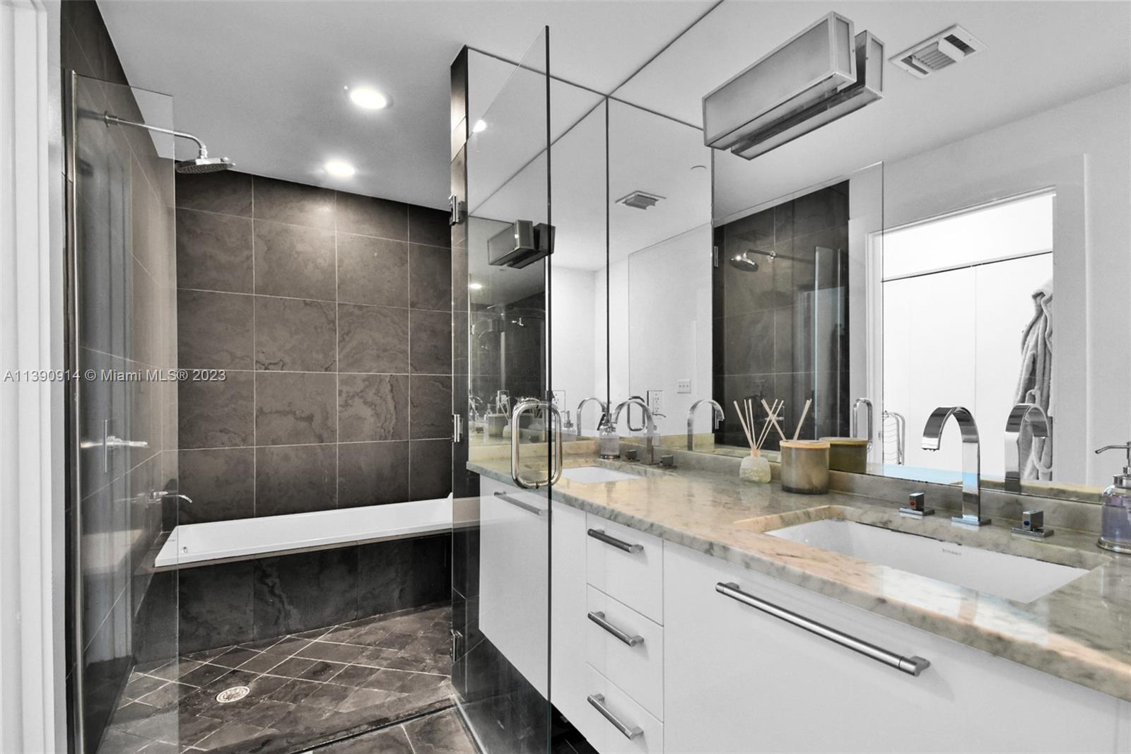 900 Biscayne Boulevard, Unit 4510 Miami, FL 33132 - Photo 22 of 48 a bathroom with a sink and mirror