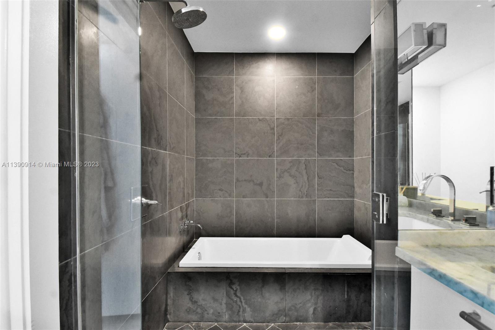 900 Biscayne Boulevard, Unit 4510 Miami, FL 33132 - Photo 26 of 48 a bathroom with a sink and a mirror