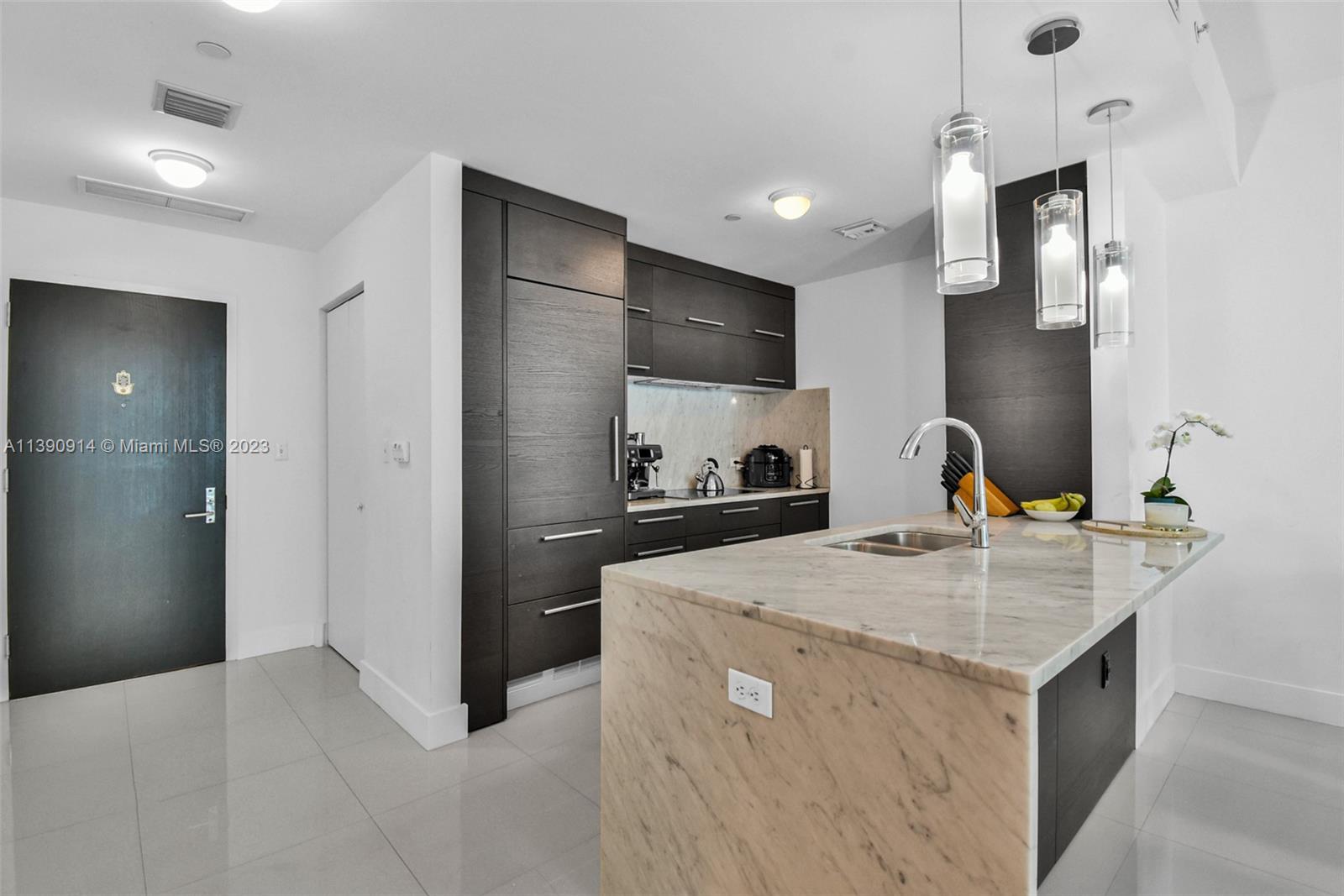 900 Biscayne Boulevard, Unit 4510 Miami, FL 33132 - Photo 9 of 48 a kitchen that has a sink and a stove in it