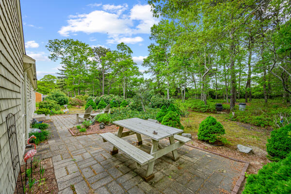 59 Beverly Road West Yarmouth, MA 02673 - Photo 11 of 33 a view of a backyard with sitting area