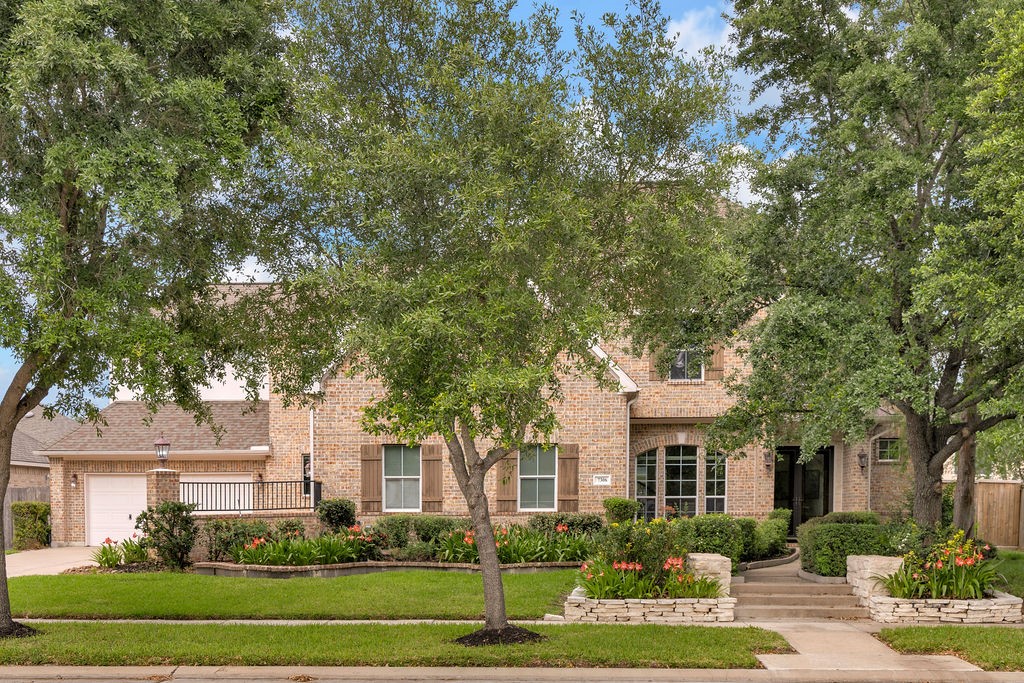 7306 Starflower Katy, TX 77494 - Photo 1 of 50 a front view of a house with a yard