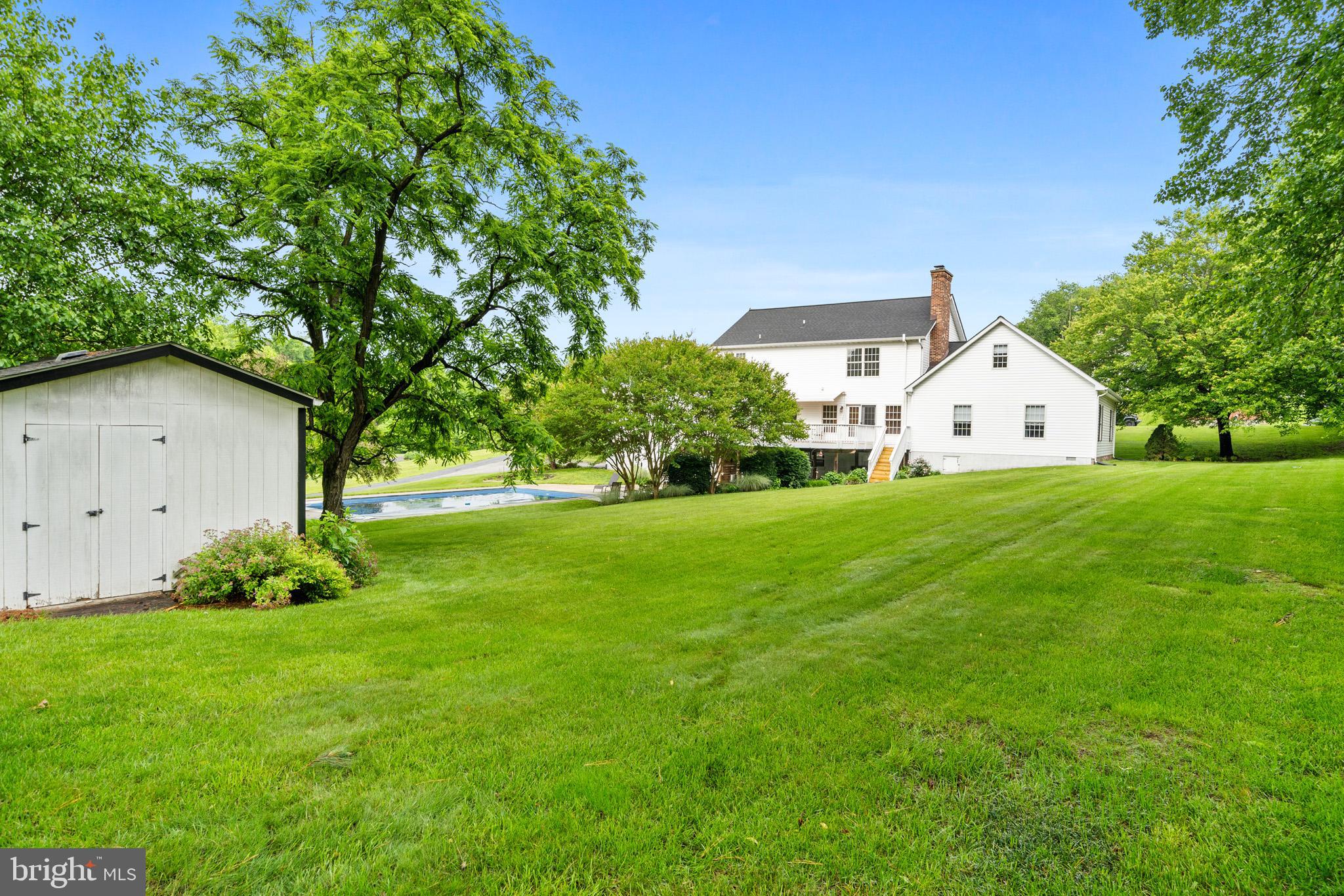 7950 Hampton Way Owings, MD 20736 - Photo 11 of 48 a front view of a house with garden