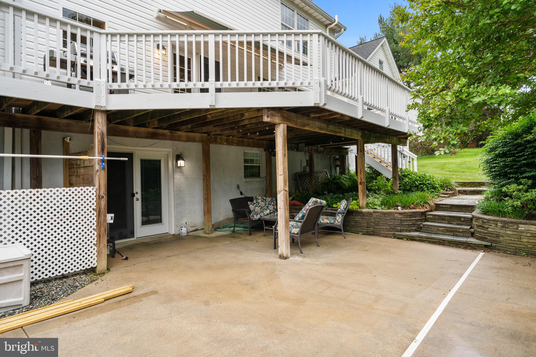 7950 Hampton Way Owings, MD 20736 - Photo 13 of 48 a view of a house with backyard porch and sitting area