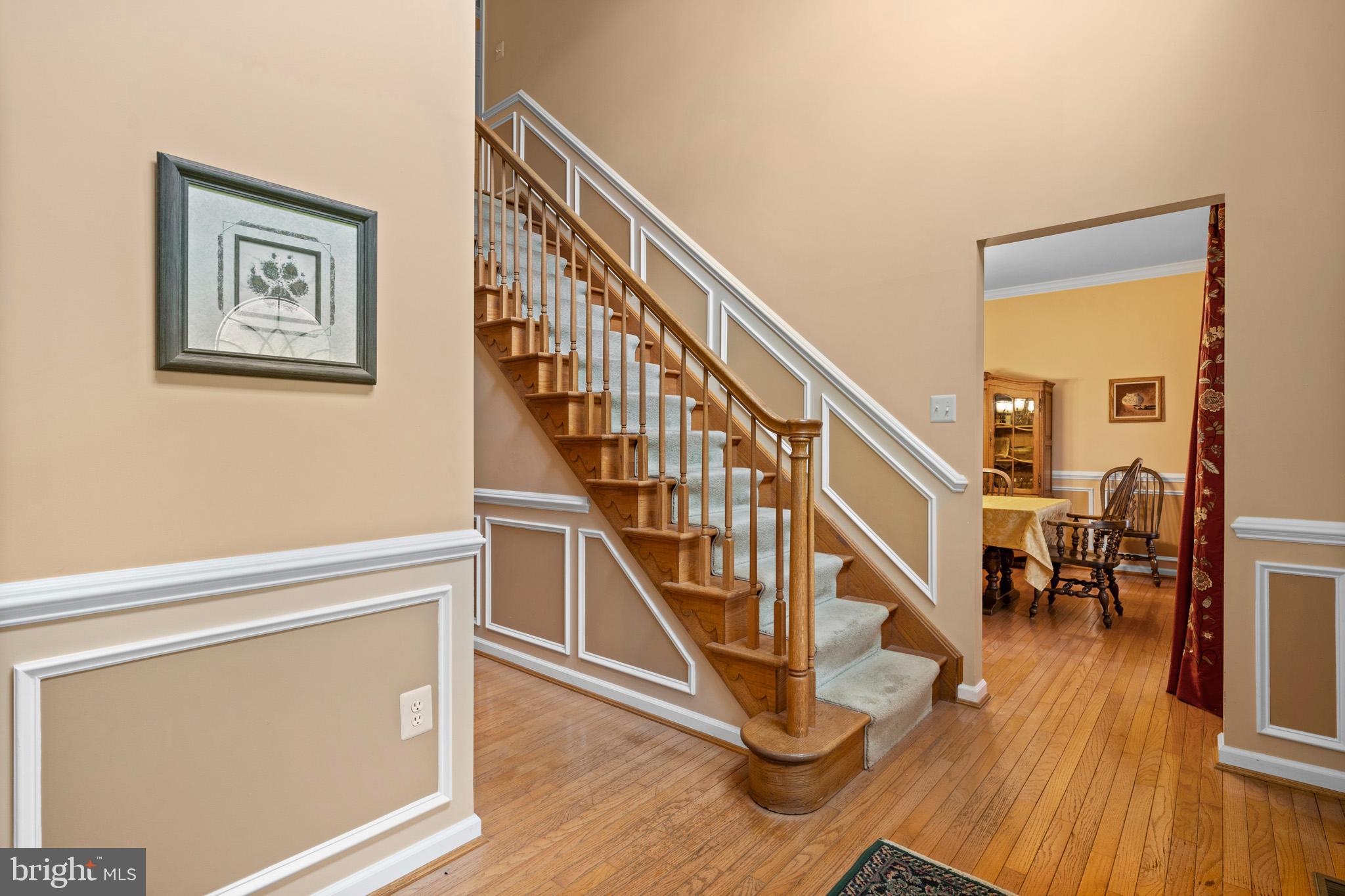 7950 Hampton Way Owings, MD 20736 - Photo 14 of 48 a view of entryway and hall with wooden floor