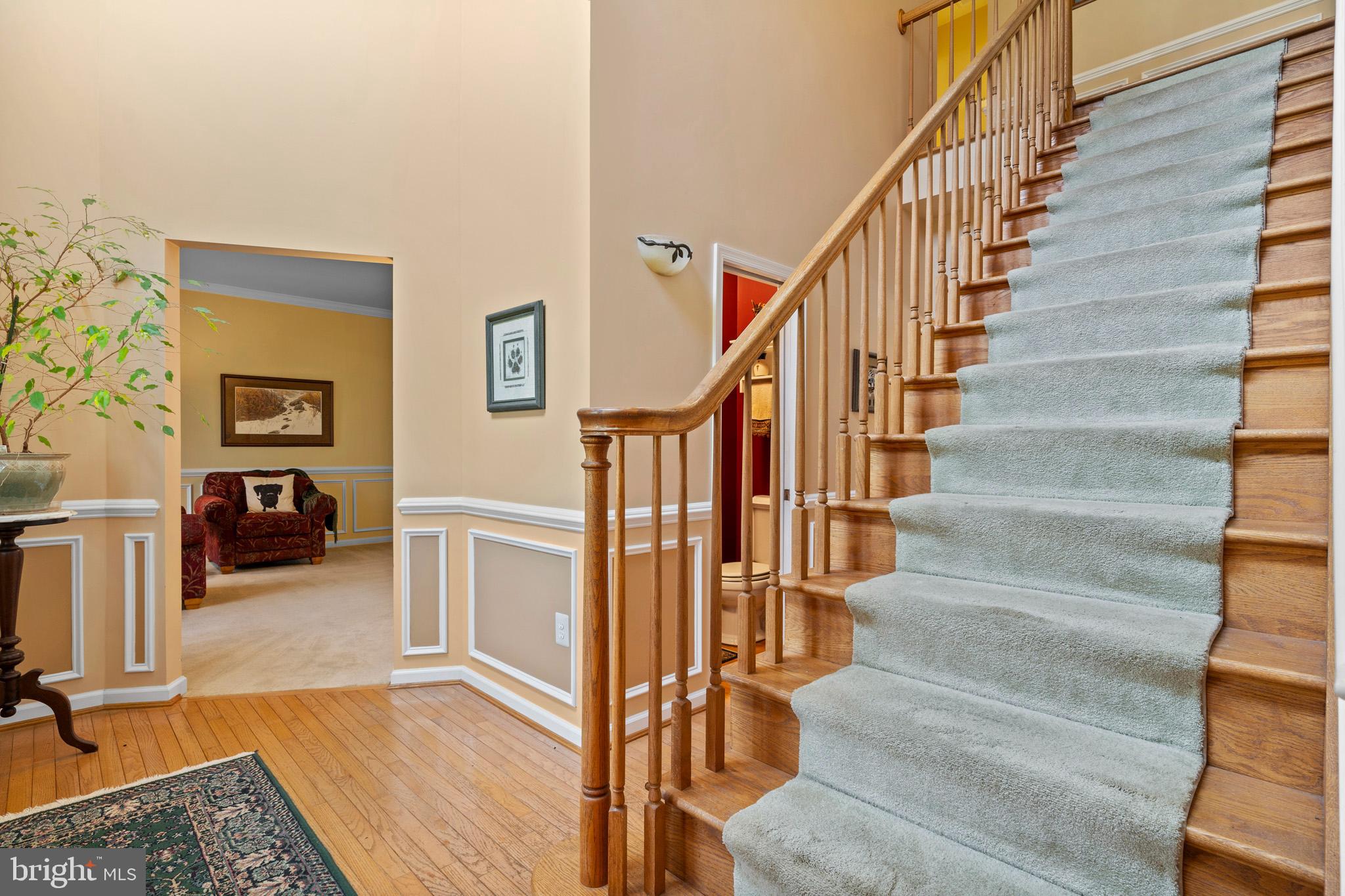 7950 Hampton Way Owings, MD 20736 - Photo 15 of 48 a view of entryway and hall with wooden floor