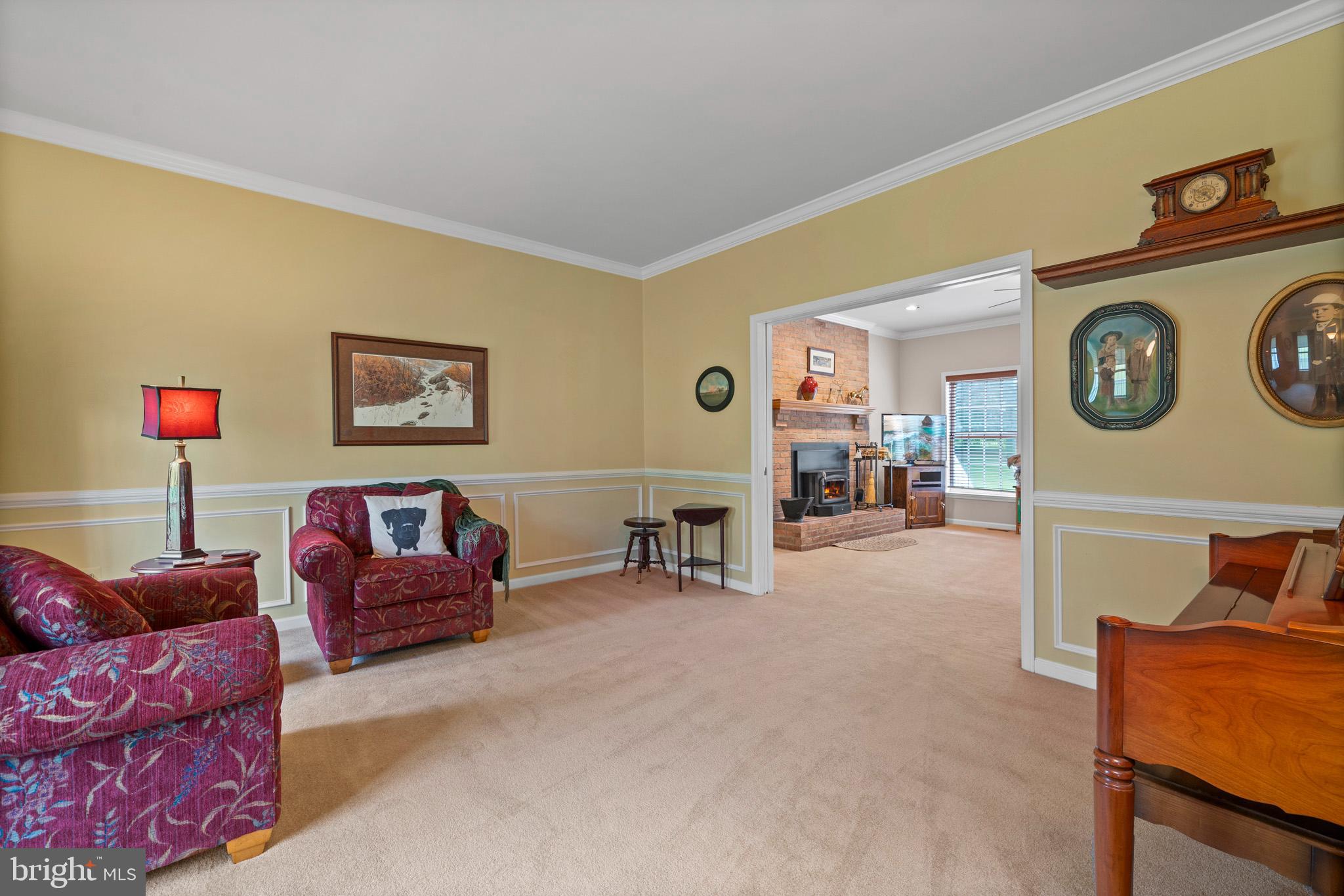 7950 Hampton Way Owings, MD 20736 - Photo 18 of 48 a living room with furniture and a clock