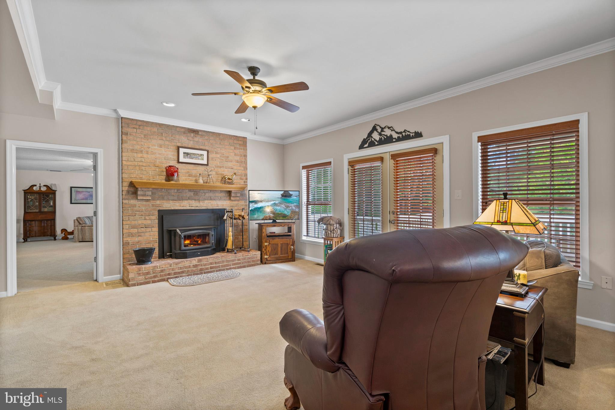 7950 Hampton Way Owings, MD 20736 - Photo 21 of 48 a bed room with furniture and a fireplace