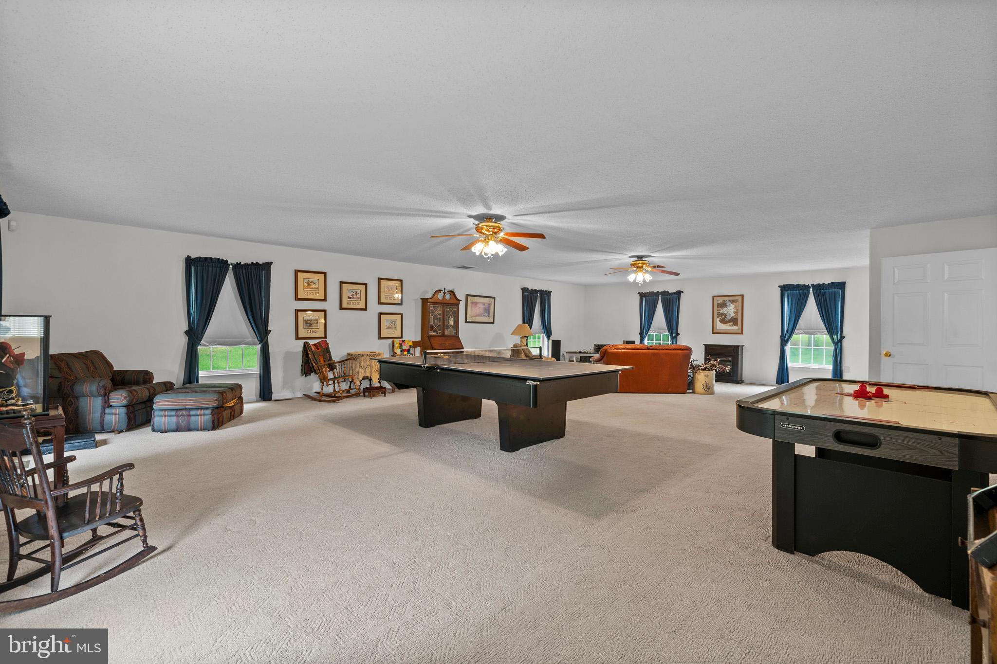 7950 Hampton Way Owings, MD 20736 - Photo 28 of 48 a living room with a couch and dresser with wooden floor