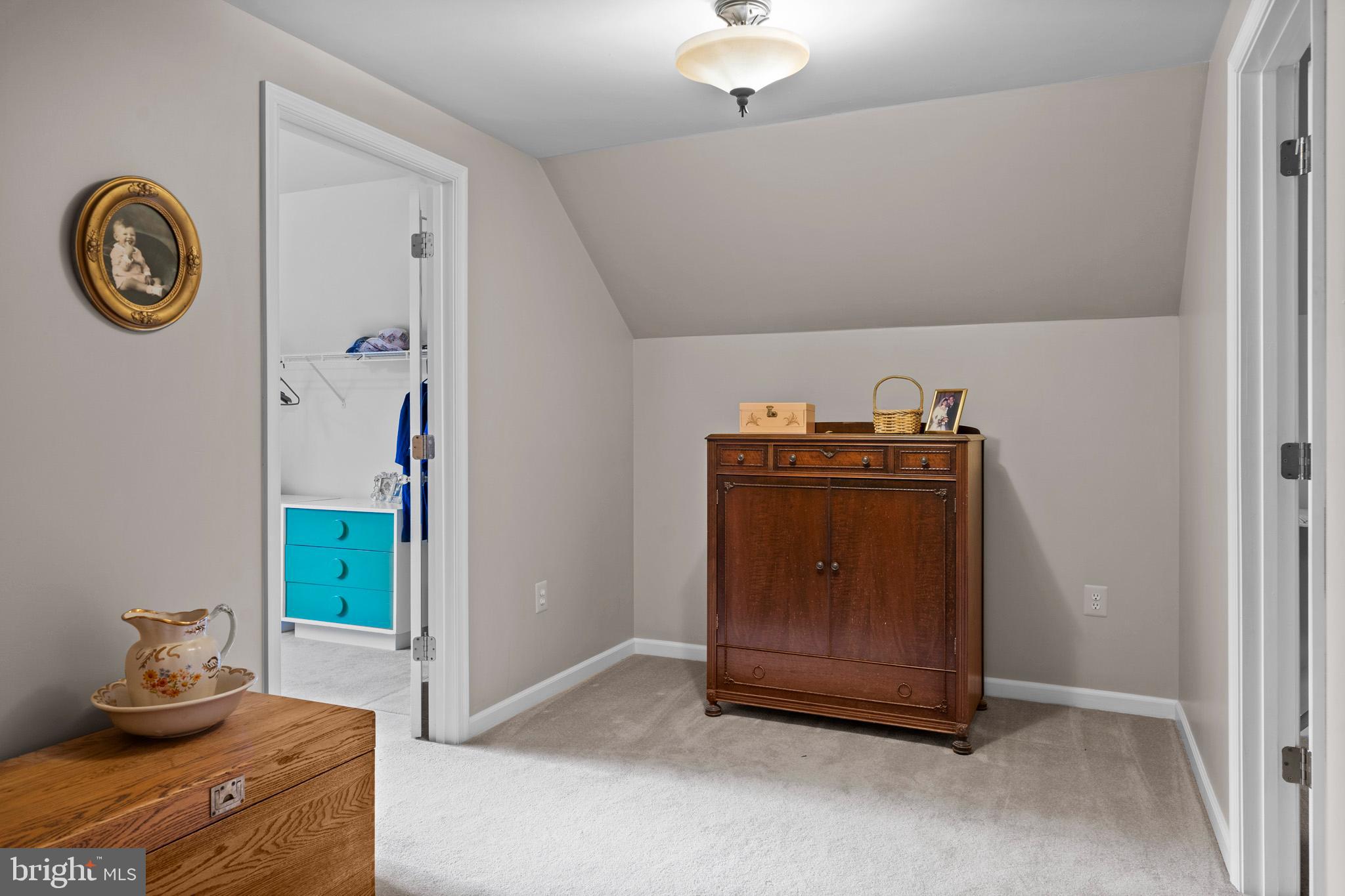 7950 Hampton Way Owings, MD 20736 - Photo 31 of 48 a room with a table and a clock