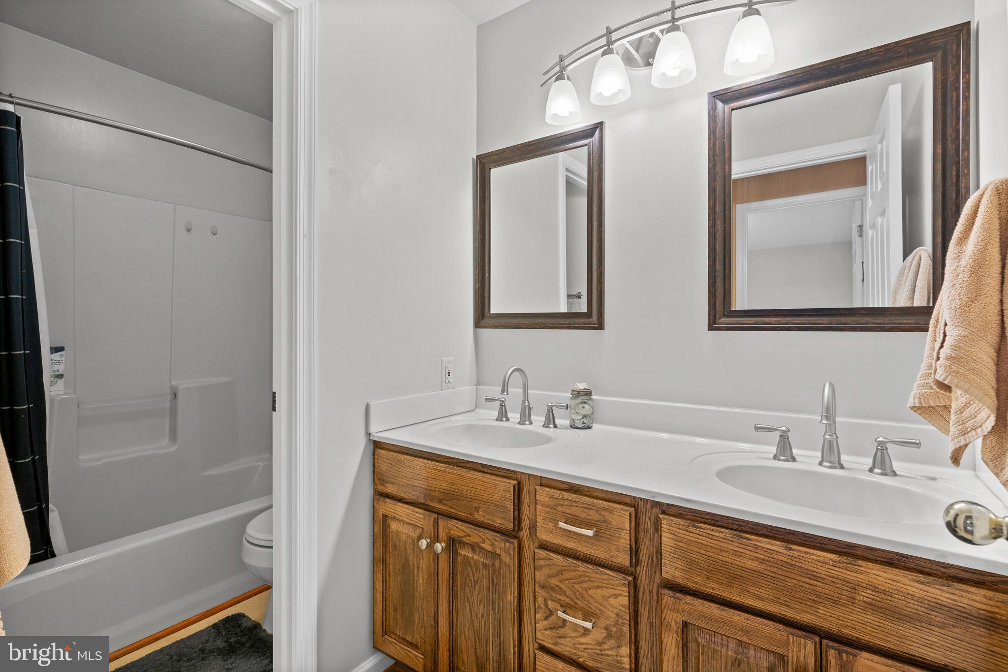 7950 Hampton Way Owings, MD 20736 - Photo 34 of 48 a bathroom with a granite countertop sink mirror and double
