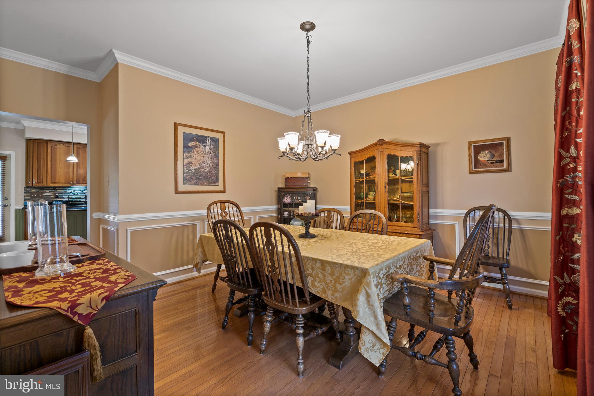7950 Hampton Way Owings, MD 20736 - Photo 38 of 48 a view of a dining room with furniture and wooden floor