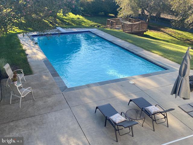 7950 Hampton Way Owings, MD 20736 - Photo 44 of 48 a view of swimming pool with a yard
