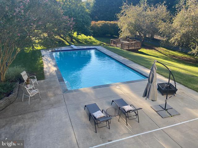 7950 Hampton Way Owings, MD 20736 - Photo 46 of 48 a view of a chairs and table in patio