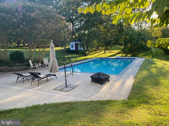 7950 Hampton Way Owings, MD 20736 - Photo 47 of 48 a swimming pool with outdoor seating and yard
