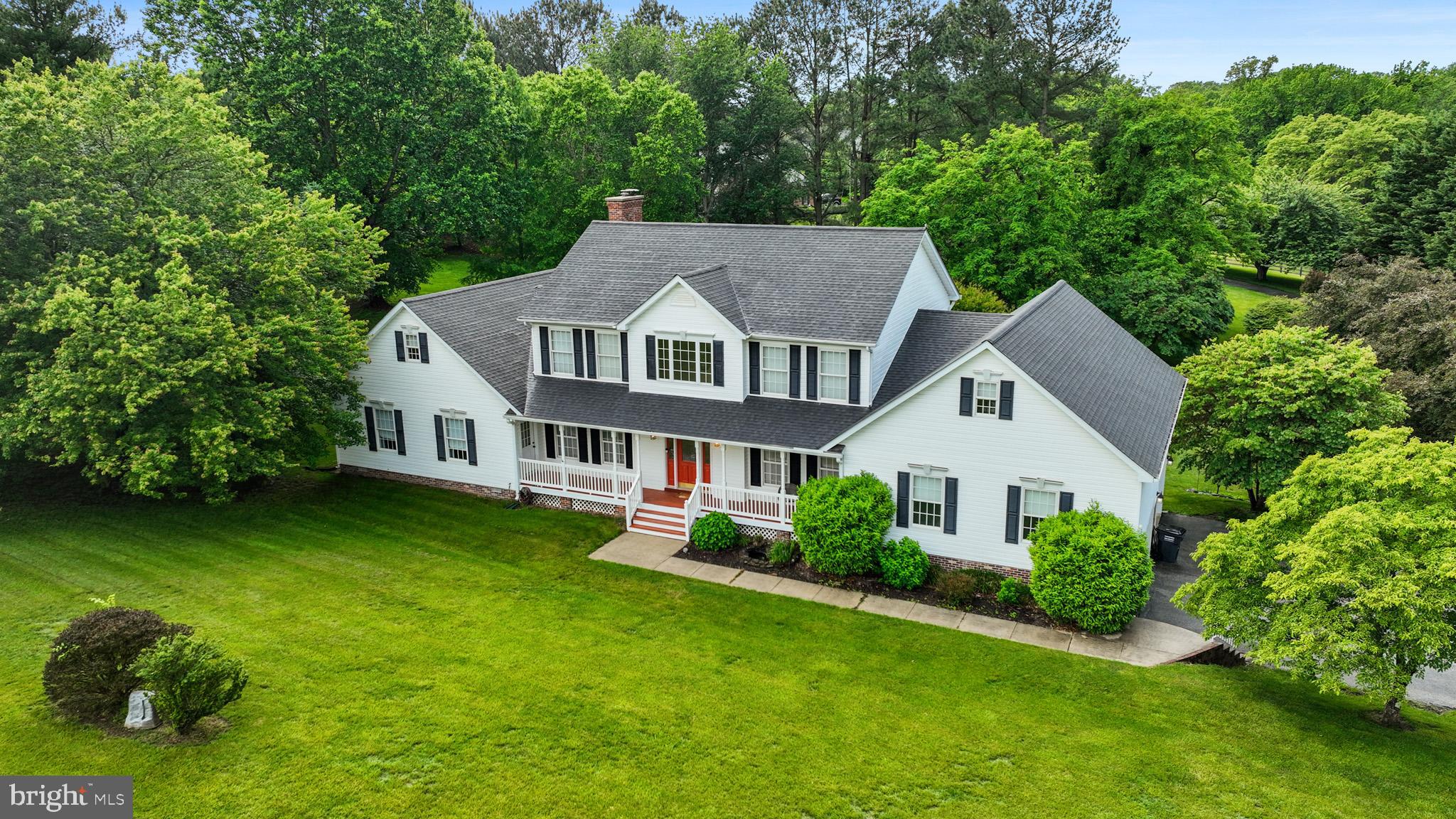 7950 Hampton Way Owings, MD 20736 - Photo 6 of 48 a aerial view of a house next to a big yard and large trees