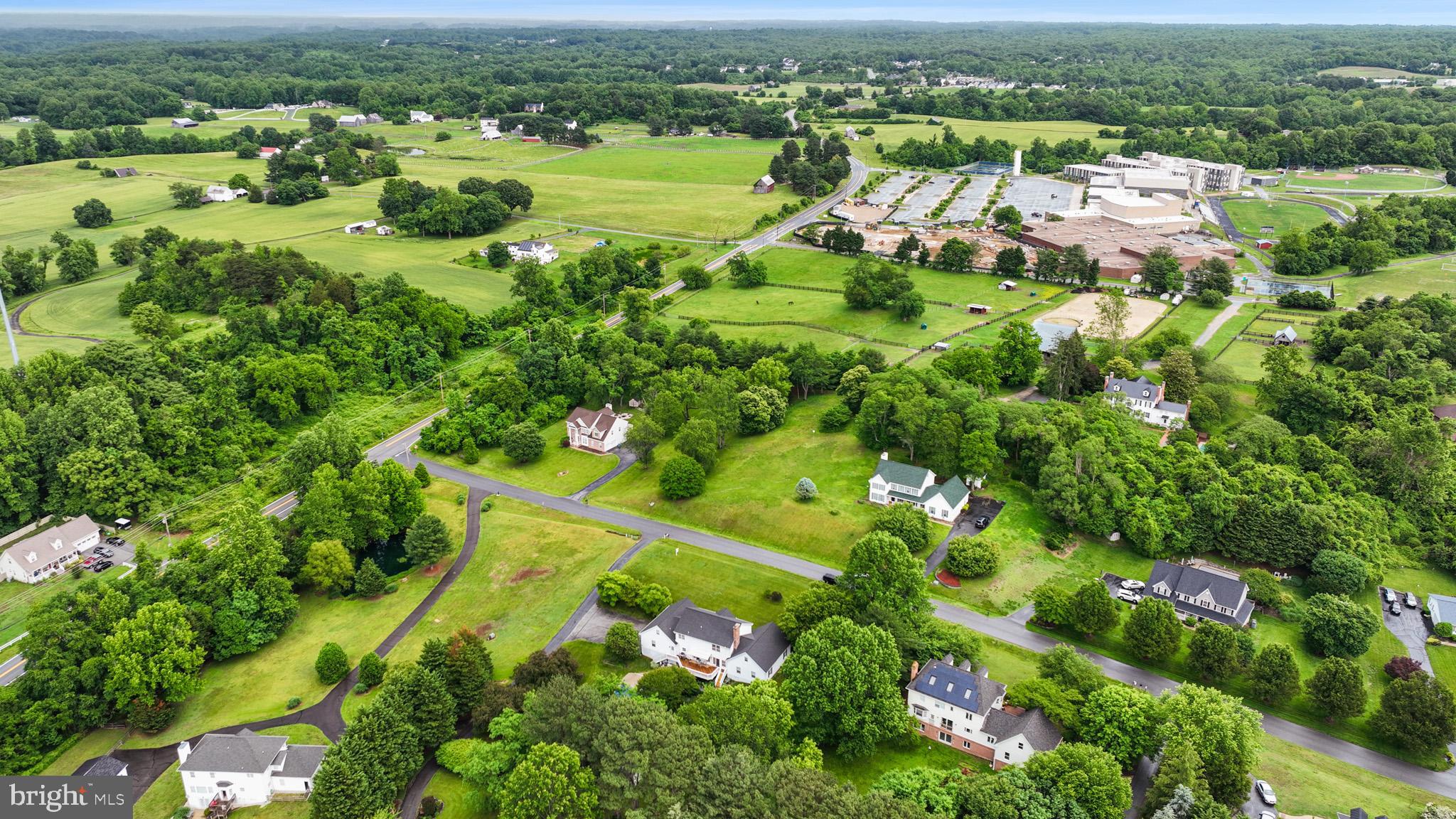 7950 Hampton Way Owings, MD 20736 - Photo 7 of 48 an aerial view of residential houses with outdoor space and trees