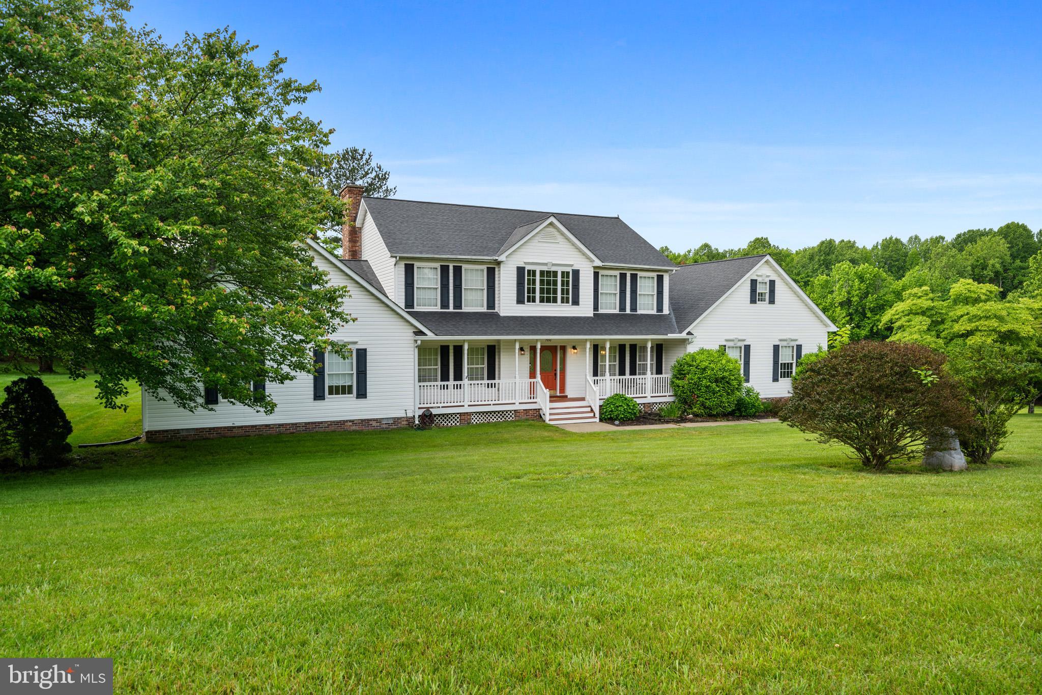 7950 Hampton Way Owings, MD 20736 - Photo 8 of 48 a front view of a house with garden