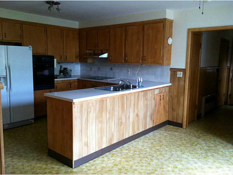 19 West Bel Air Road Cranston, RI 02920 - Photo 4 of 17 Kitchen. Plenty of cabinet and counter space. Solid wood cabinets and Corian countertop.