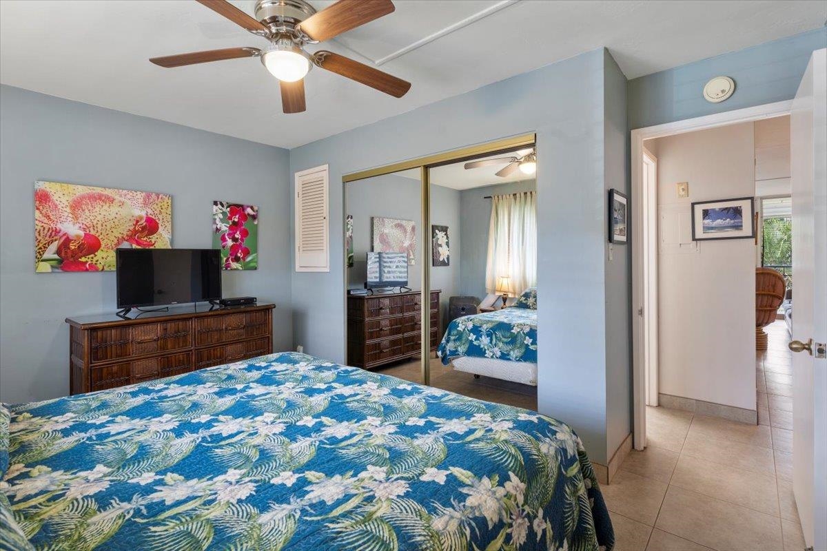 2495 South Kihei Road, Unit 254 Kihei, HI 96753 - Photo 23 of 30 a bedroom with a bed and a flat screen tv