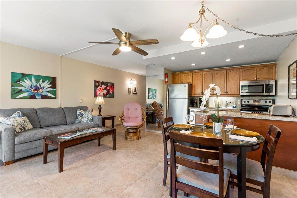 2495 South Kihei Road, Unit 254 Kihei, HI 96753 - Photo 5 of 30 a living room with furniture kitchen view and a chandelier