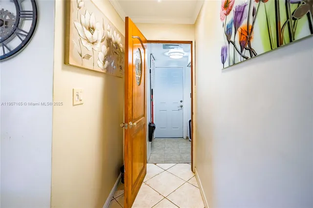 a view of a hallway with bathroom