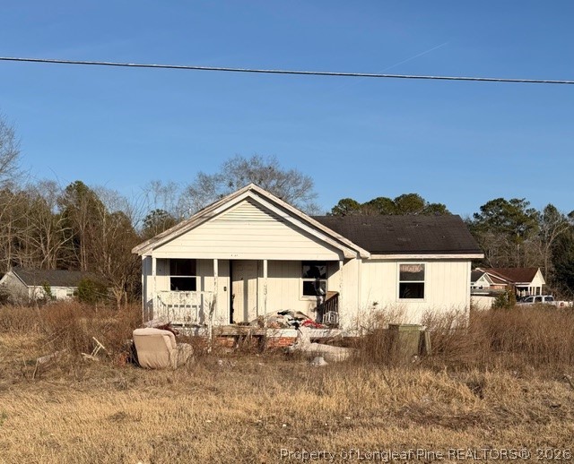 4201 Dudley Road Fayetteville, NC 28312 - Photo 2 of 13 a view of a house with backyard and sitting area