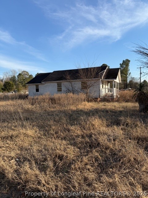 4201 Dudley Road Fayetteville, NC 28312 - Photo 5 of 13 a view of a dry yard with wooden fence
