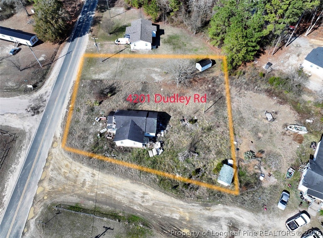 4201 Dudley Road Fayetteville, NC 28312 - Photo 6 of 13 a sign that is on the side of the road