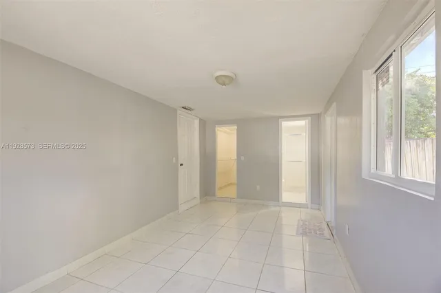 a view of an empty room with a window