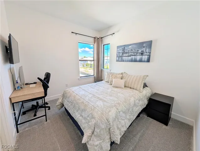 a bedroom with bed and a window