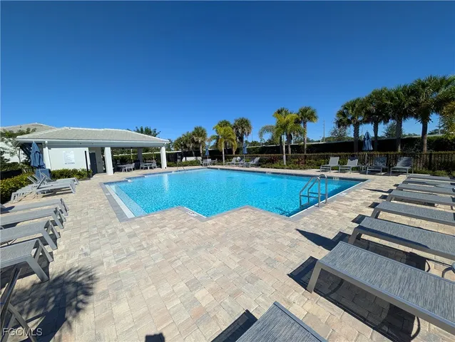 a view of a swimming pool with a patio
