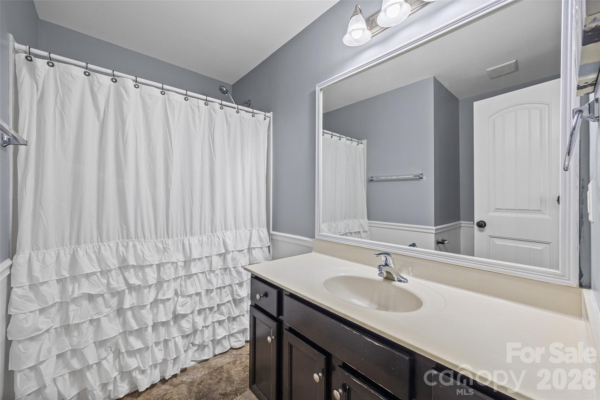 244 Makayla Court Fort Mill, SC 29715 - Photo 9 of 17 a bathroom with a sink and a mirror