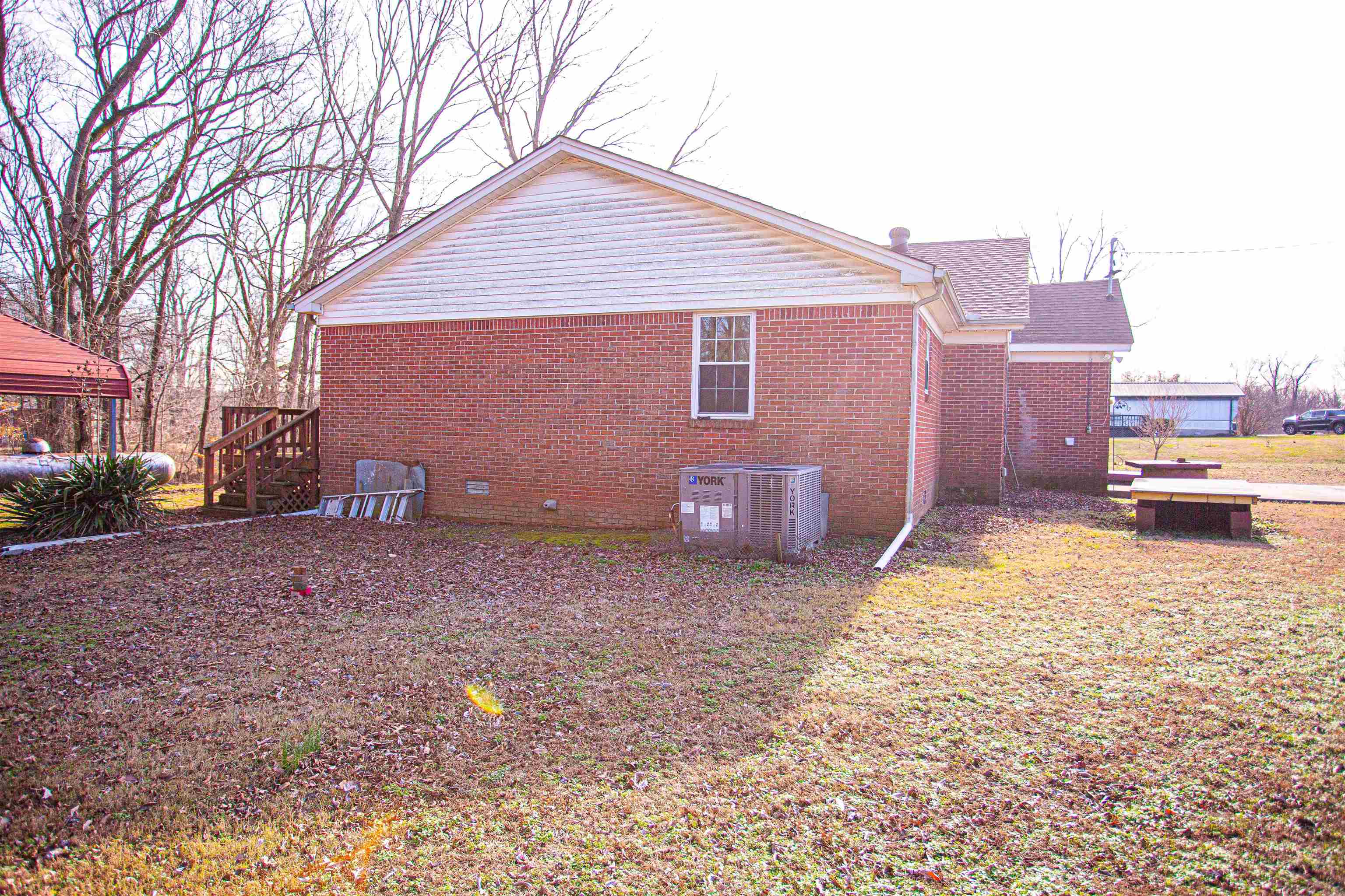 5174 Chisholm Lake Road Ripley, TN 38063 - Photo 4 of 25 a backyard of a house with lots of green space