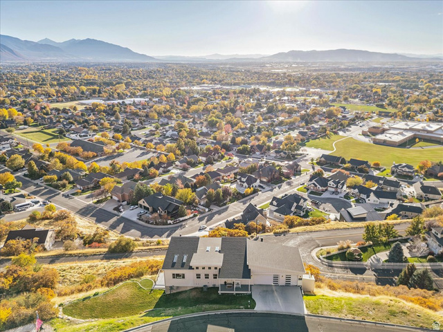 1800 Spring Oaks Drive Springville, UT 84663 - Photo 7 of 68 Aerial perspective of suburban area with mountains