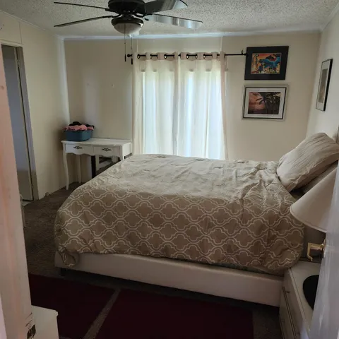 a bedroom with a bed and furniture