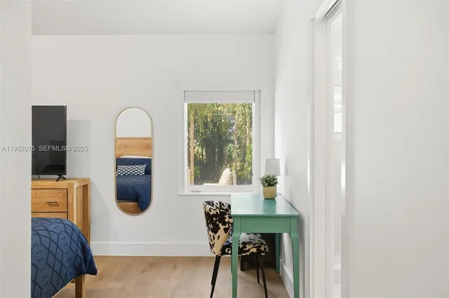 a bathroom with a toilet and shower curtain