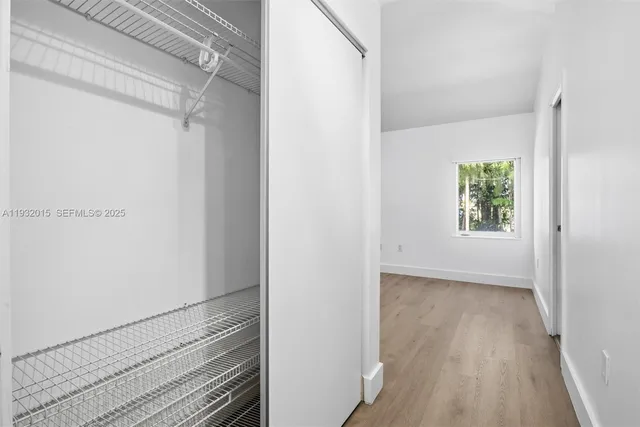 an aerial view of residential houses with outdoor space and street view