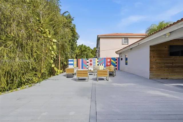 a view of a house with sitting area and furniture